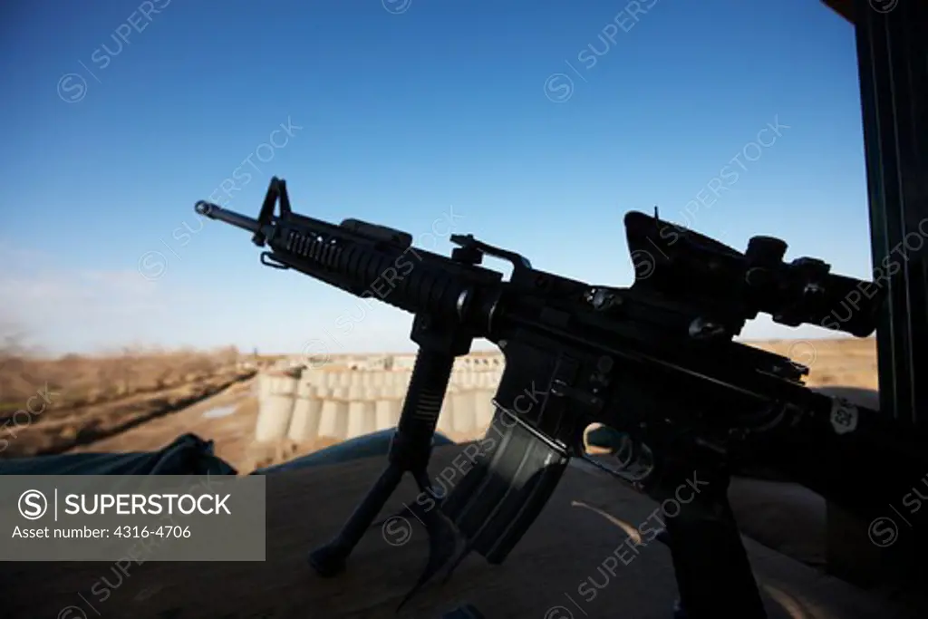 Silhouette of an M4 carbine at a guard tower, United States Marine combat outpost, Helmand Province, Afghanistan