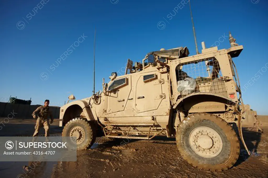 M-ATV, or Mine Resistant, Ambush Protected, All Terrain Vehicle parked at a remote, austere United States Marine Corps forward operating base in Afghanistan's Helmand Province