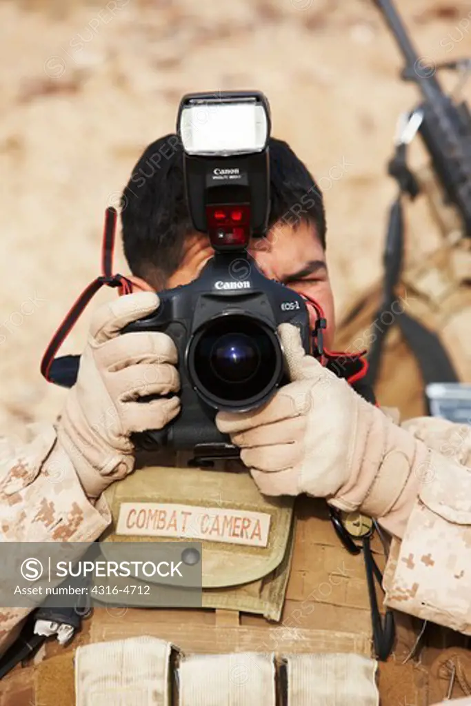 United States Marine Corps combat cameraman during a combat operation in Afghanistan's Helmand Province