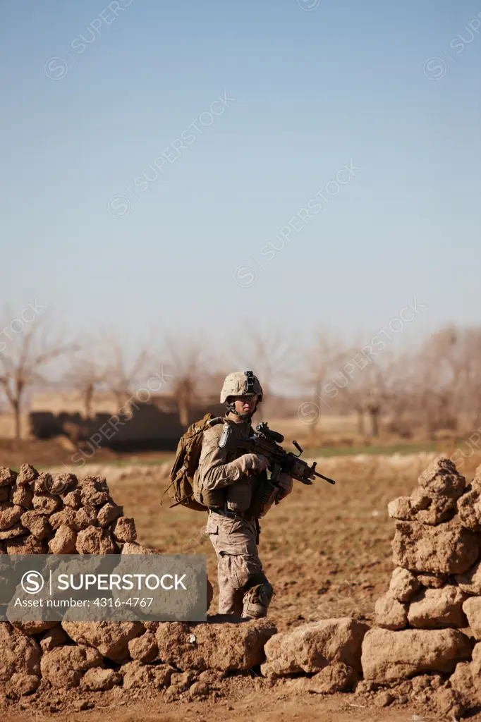 United States Marine on a combat patrol near the city of Marjah, in the Helmand Province of Afghanistan