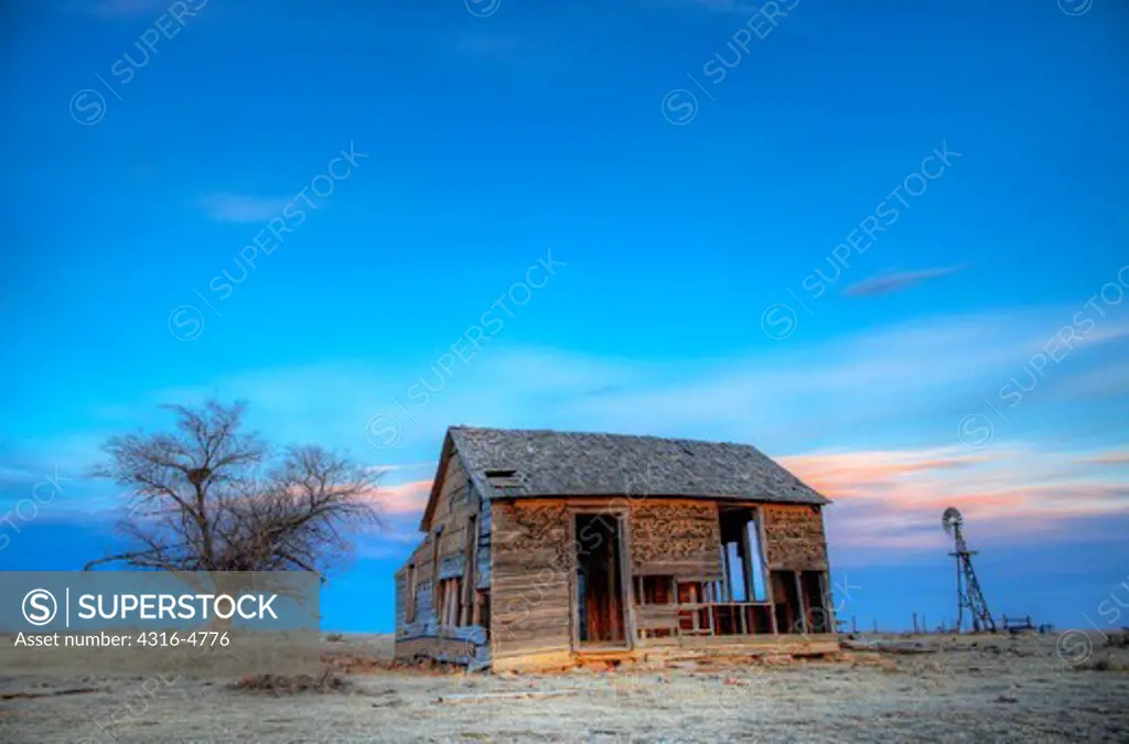 Abandoned, decaying ranch house on plains, Colorado