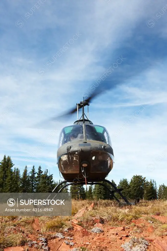 Bell OH-58 Kiowa helicopter during high altitude mountainous training, Colorado