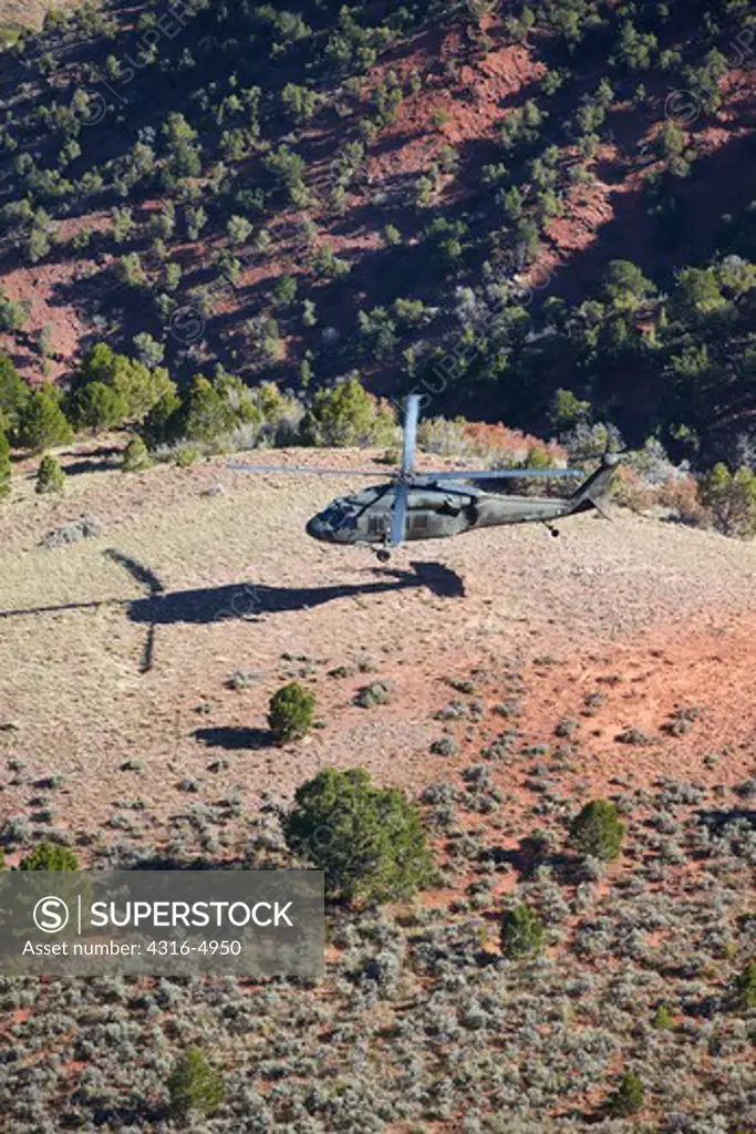 Aerial view of a UH-60 Blackhawk helicopter during high altitude mountainous training, Colorado