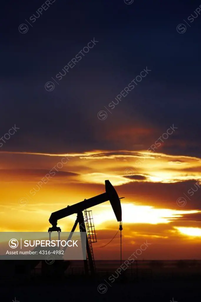 Silhouette of an oil well pump jack, Colorado