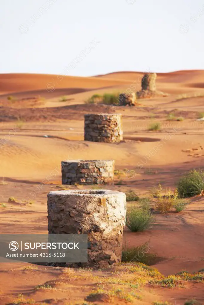 Ancient water wells in sand dunes, interior Sahara Desert, Morocco
