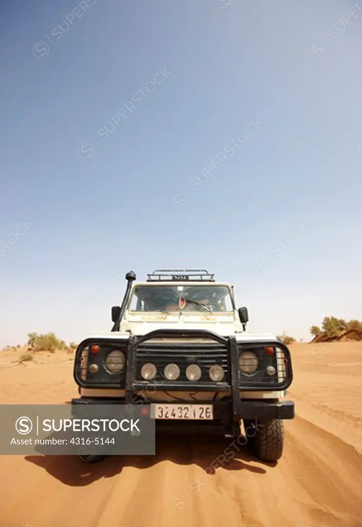 Land Rover on Sand Dune, interior Sahara Desert, Morocco, head-on view