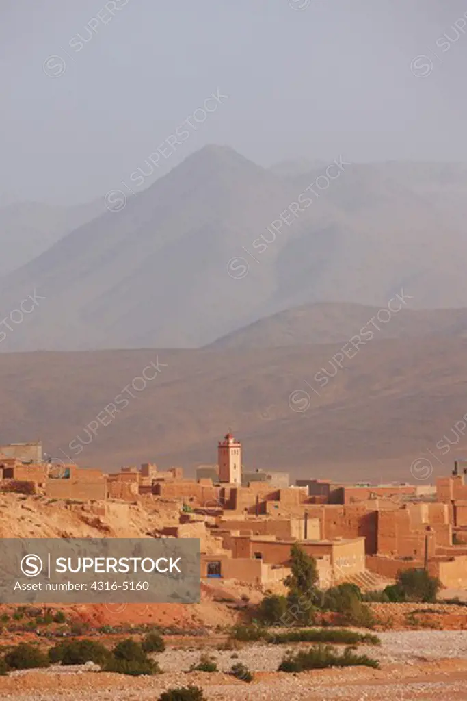 Homes built atop one another, Minaret of Mosque, Atlas Mountains, Morocco