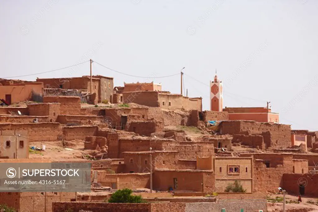Homes built atop one another, Minaret of Mosque, Morocco