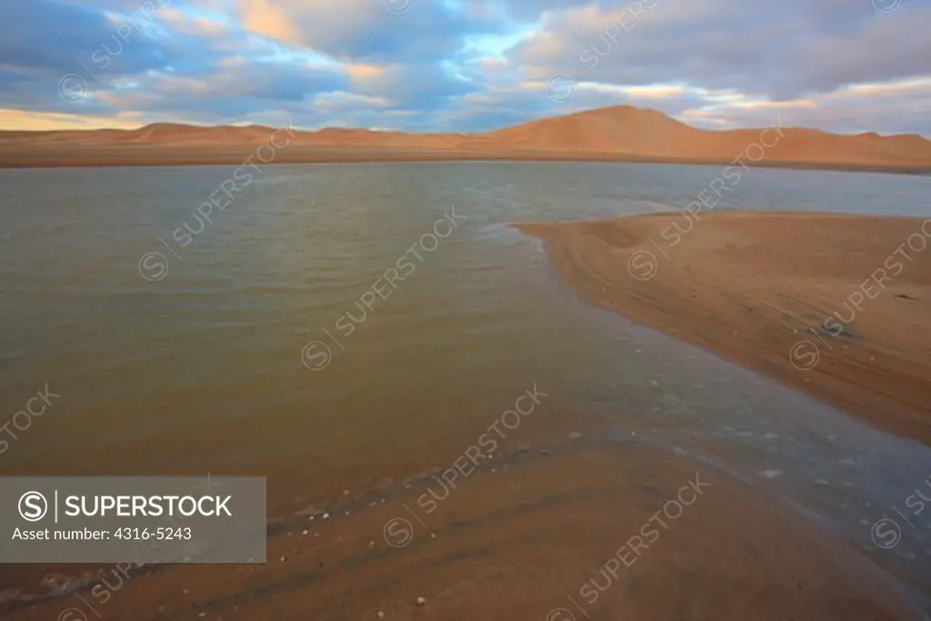 Estuary, Sand Dunes, Atlantic Shoreline, where the Sahara Desert meets the Sea, southern Morocco, Atlantic Shoreline, Oued Chbika