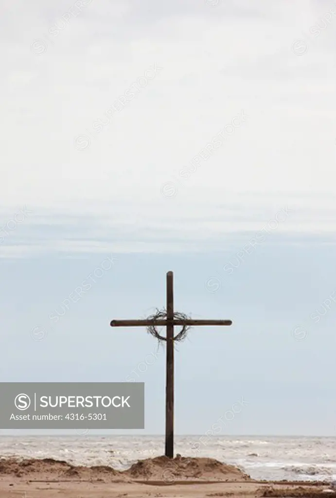 Cross made of pilings for elevating houses to protect from hurricane storm surges, Peveto Beach, Louisiana, USA