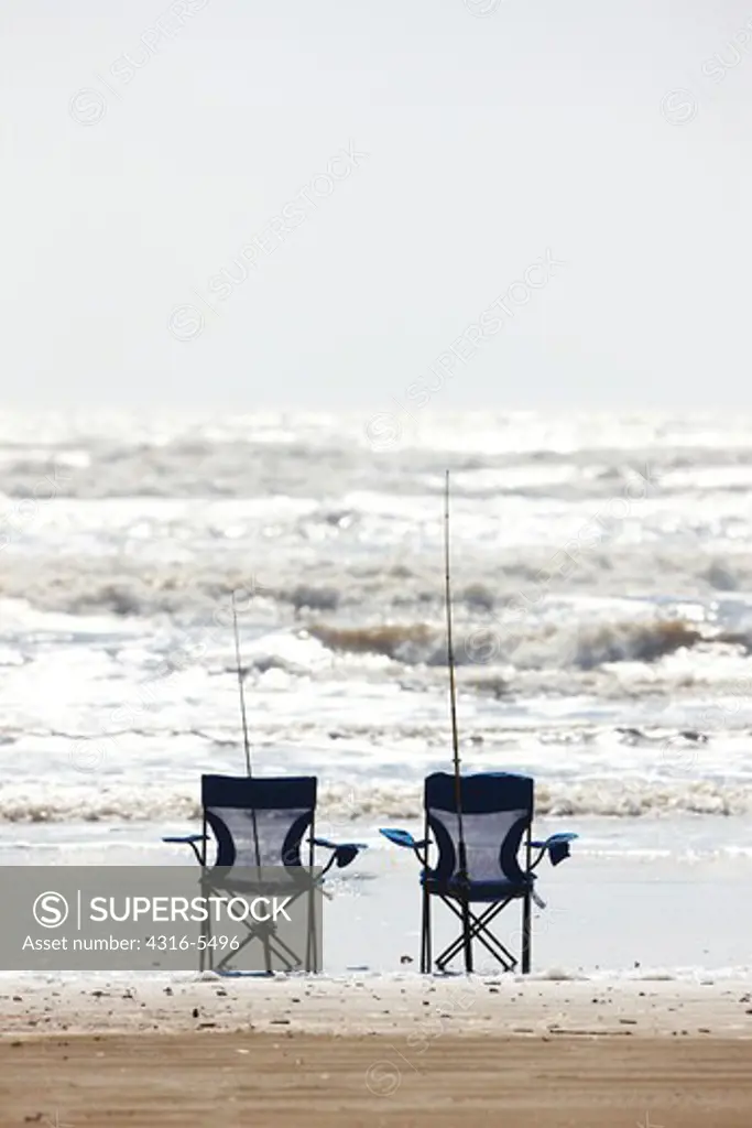 Fishing rods leaning against folding chairs, Galveston Island, Galveston County, Texas, USA