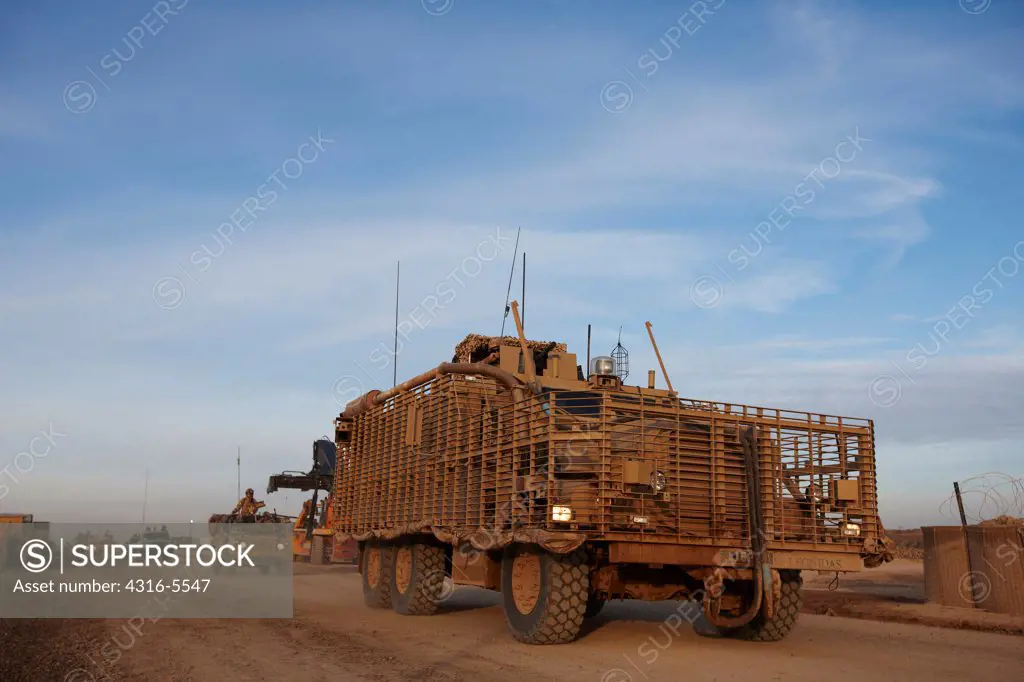 An MRAP or Mine Resistant Ambush Protected Vehicle fitted with a Lightweight RPG Protection Kit (LROD) to protect the vehicle from shaped charges in Rocket Propelled Grenades (RPGs), Camp Leatherneck, Helmand Province, Afghanistan