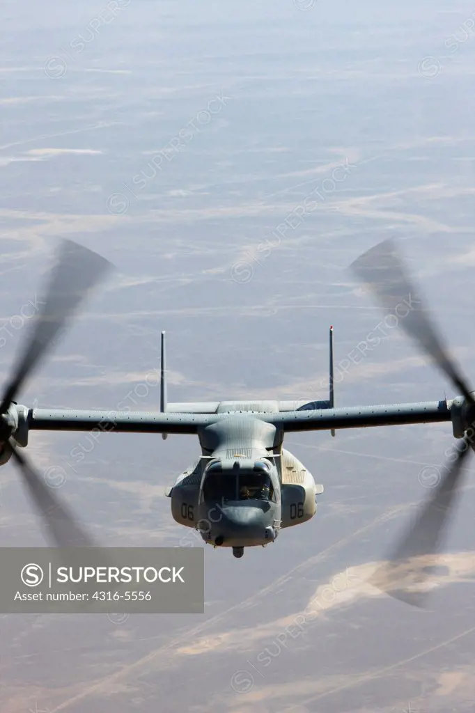 Air to air in flight view of a United States Marine Corps MV-22 Osprey during a combat operation over the Helmand Province, Afghanistan