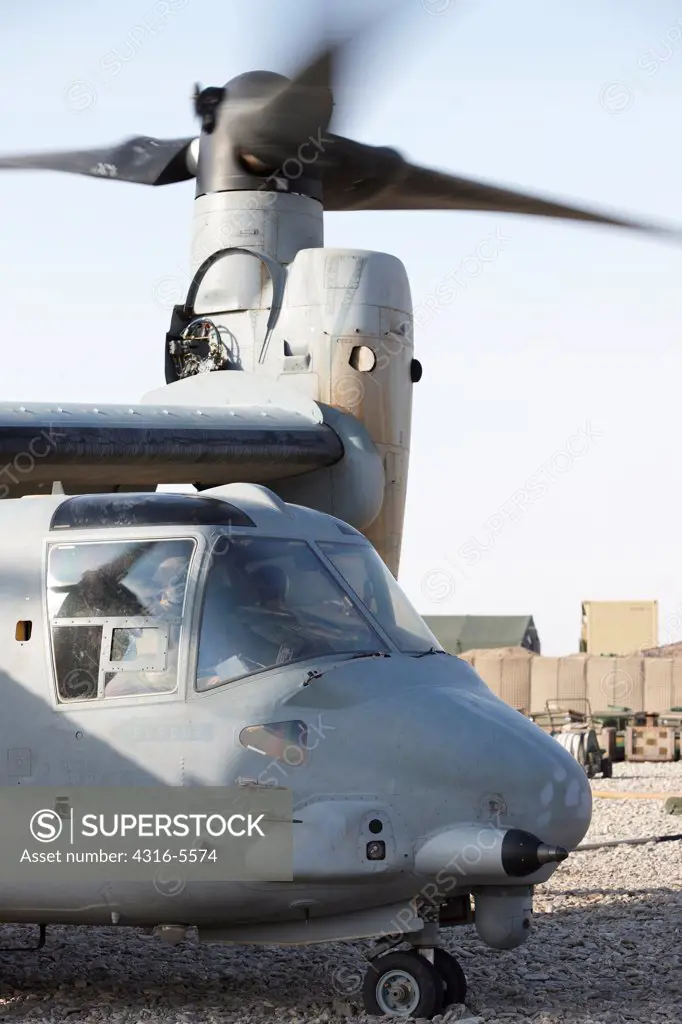 United States Marine refuels an MV-22 Osprey at a remote forward operating base in Afghanistan's Helmand Province