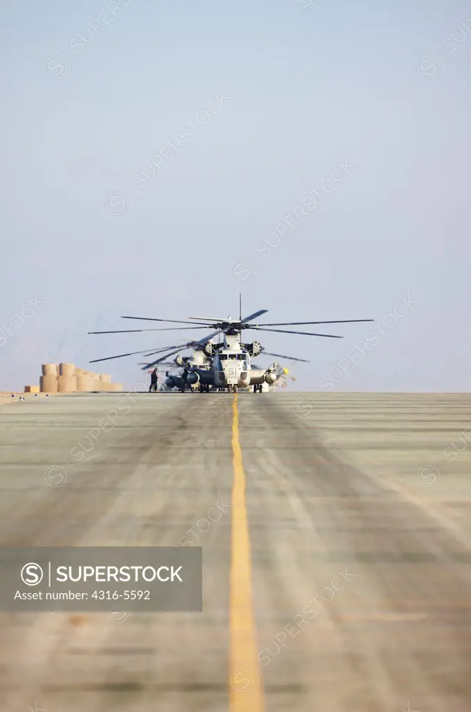 United States Marine Corps CH-53D Sea Stallion heavy lift transport helicopter taxis along flight line at Camp Bastion, Helmand Province, Afghanistan