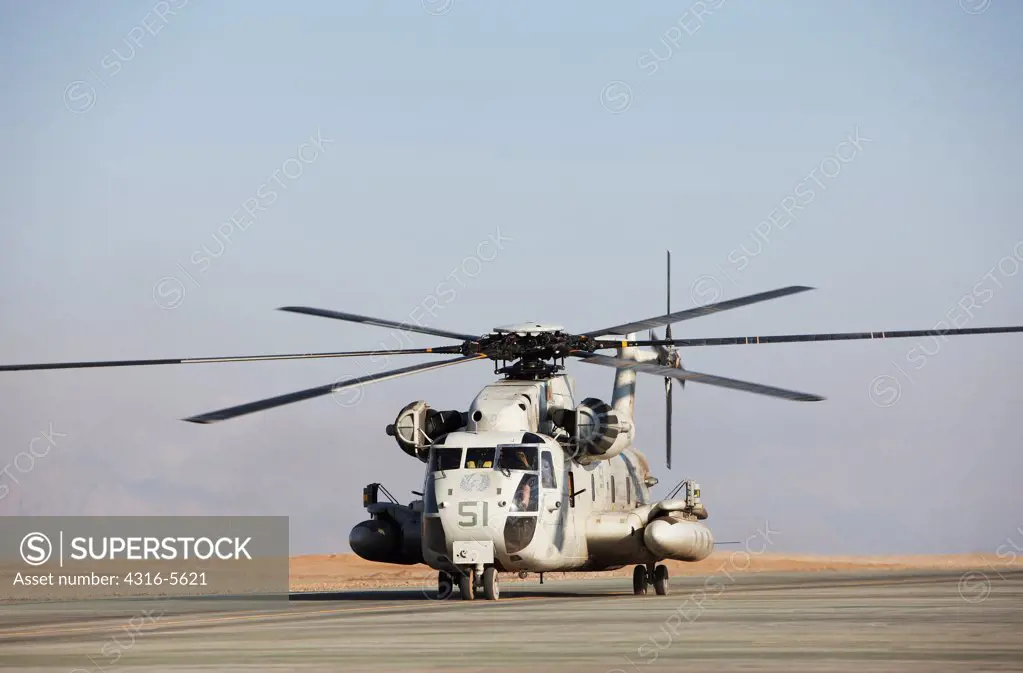 United States Marine Corps CH-53D Sea Stallion heavy lift transport helicopter taxis along flight line at Camp Bastion, Helmand Province, Afghanistan