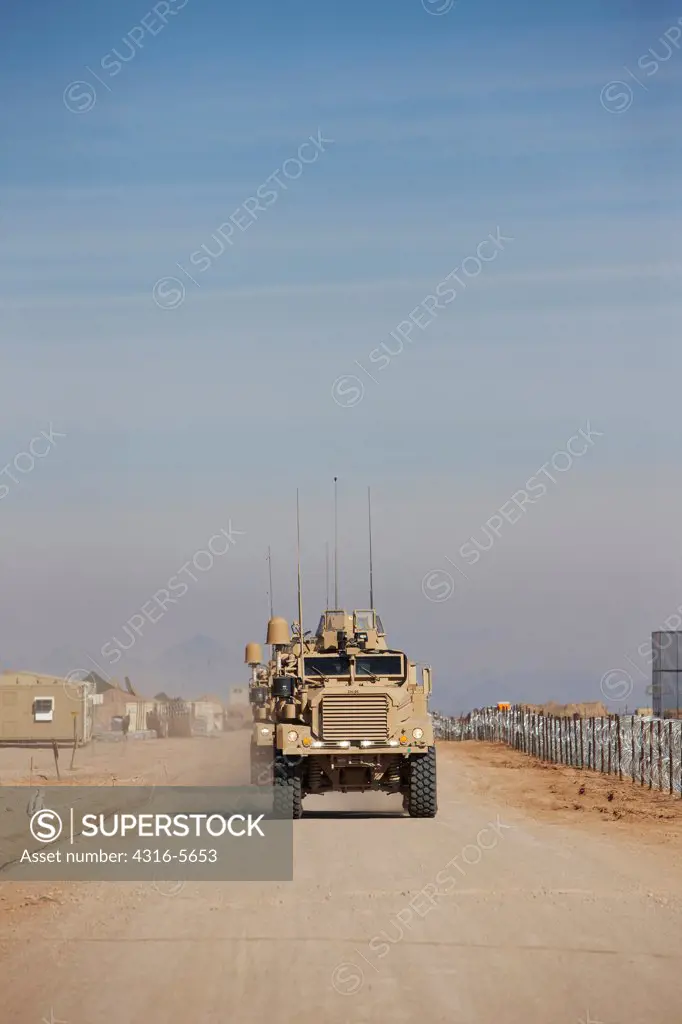 Approaching convoy of United States Marine Corps MRAPs or Mine Resistant Ambush Protected Vehicle, Camp Leatherneck, Helmand Province, Afghanistan