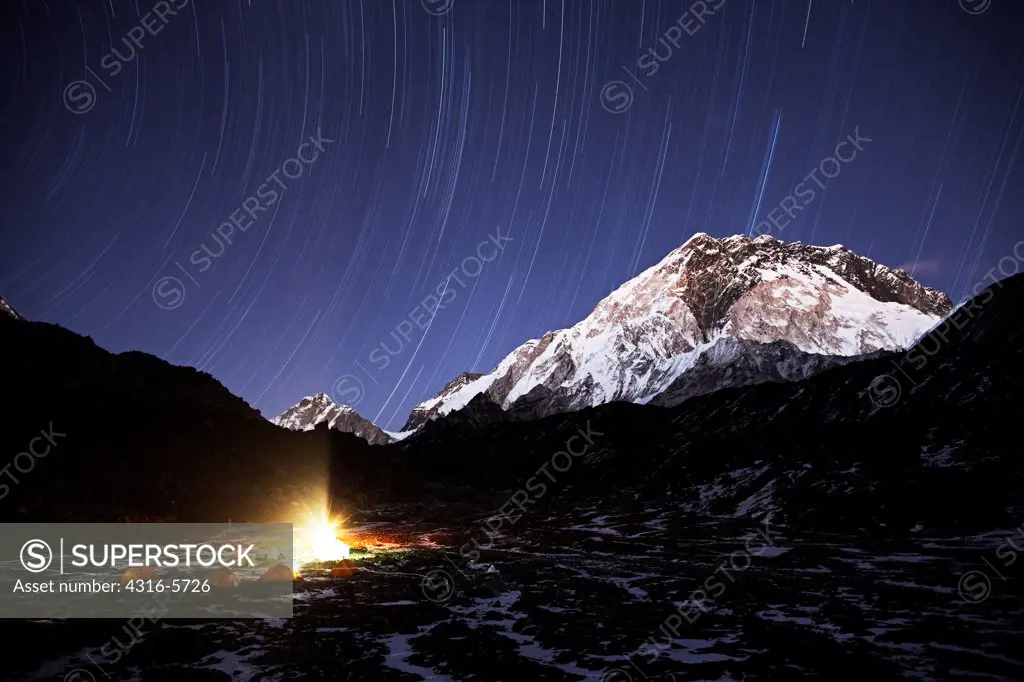 Nepal, Sagarmatha National Park, Khumbu Region near Mount Everest, Star trails over camp below Mera Peak, also known as Kongma Tse