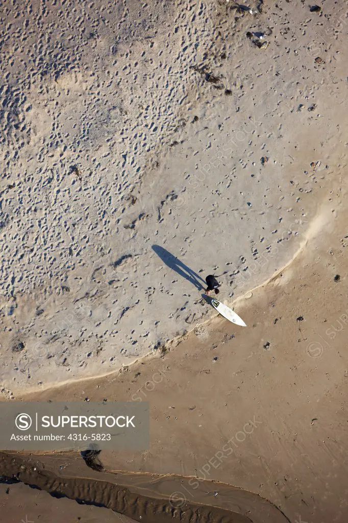 USA, California, Jalama Beach, Aerial view of surfer on beach