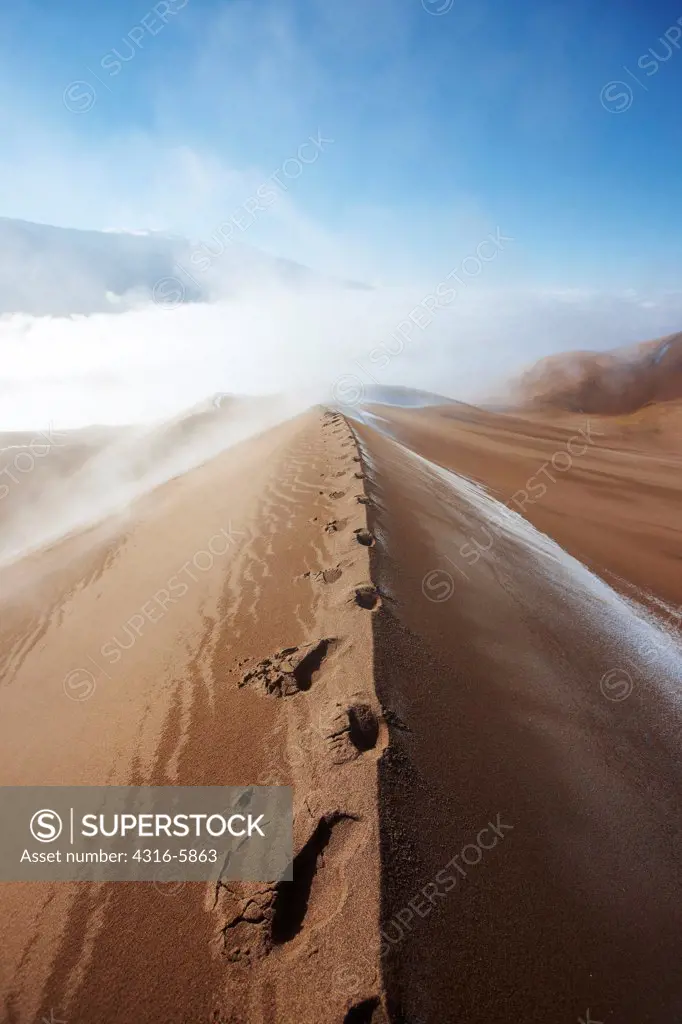 USA, Colorado, San Luis Valley, Footsteps on crest of sand dune after snow storm at Great Sand Dunes National Park