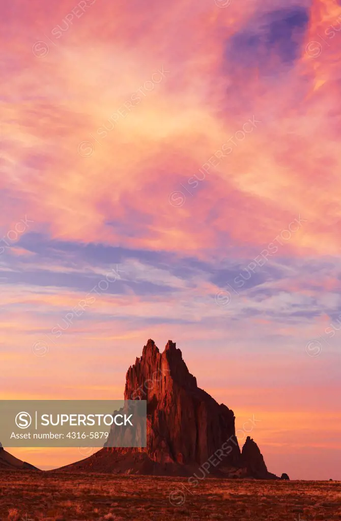 USA, New Mexico, Navajo Nation, Silhouette of Ship Rock at dusk