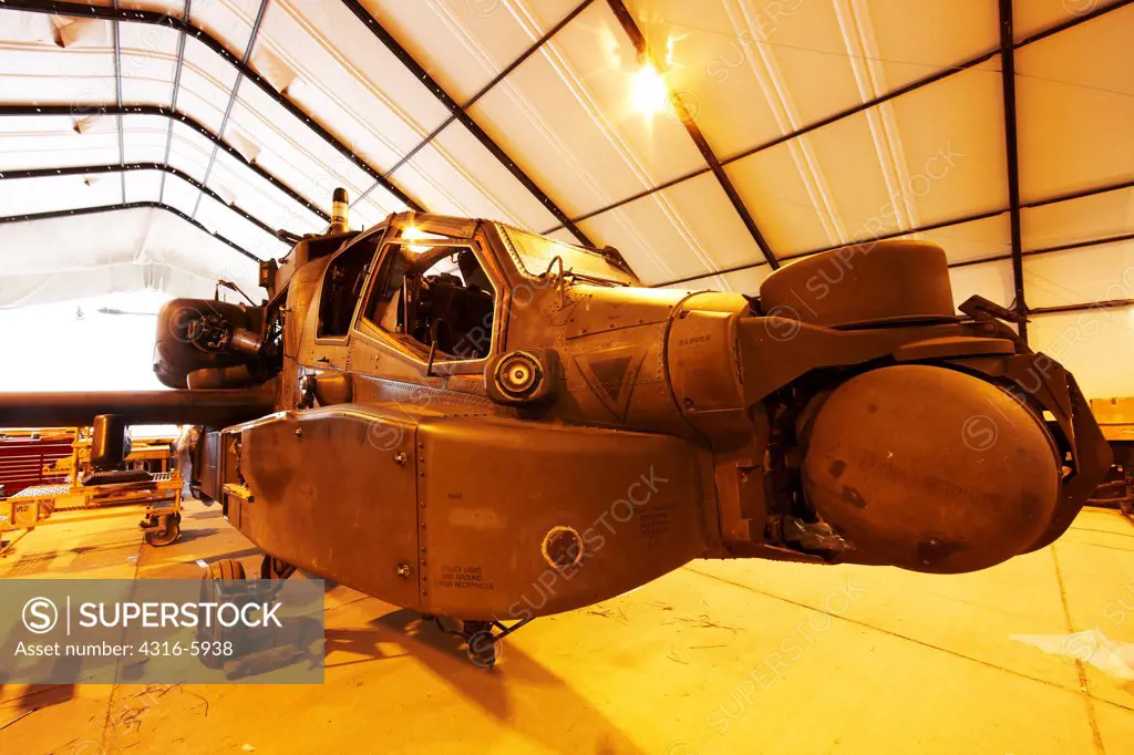 Afghanistan, Bagram, Bagram Airfield, United States Army Boeing AH-64D Apache helicopter undergoing maintenance