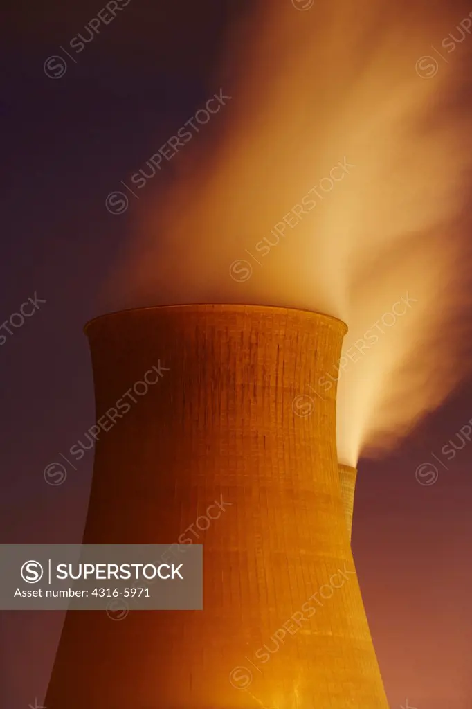 Cooling towers of power plant at night