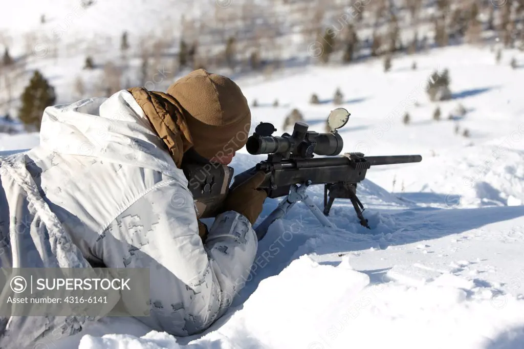 USA, California, United States Marine Corps Scout / Snipers during mountain high angle sniper training in winter, Marine Corps Mountain Warfare Training Center near Bridgeport