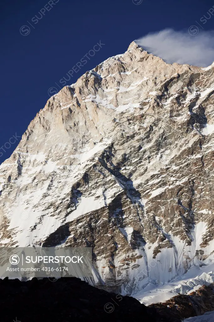 Nepal, Makalu-Barun National Park, Climber beneath West Face of Makalu, fifth highest mountain in world at 8,481 meters above sea level