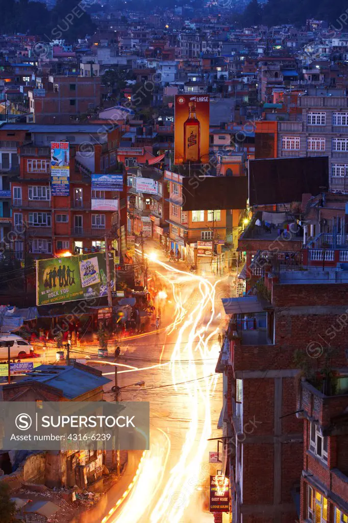 Nepal, Kathmandu, city view with blurry headlights, dusk