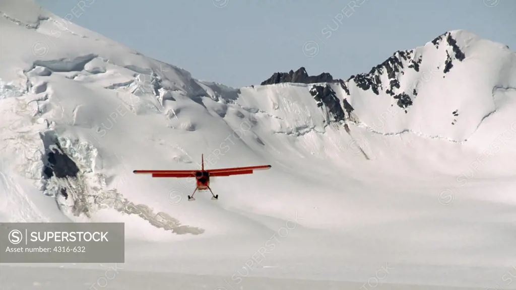 A Ski Equipped Light Aircraft Comes In for a Glacier Landing