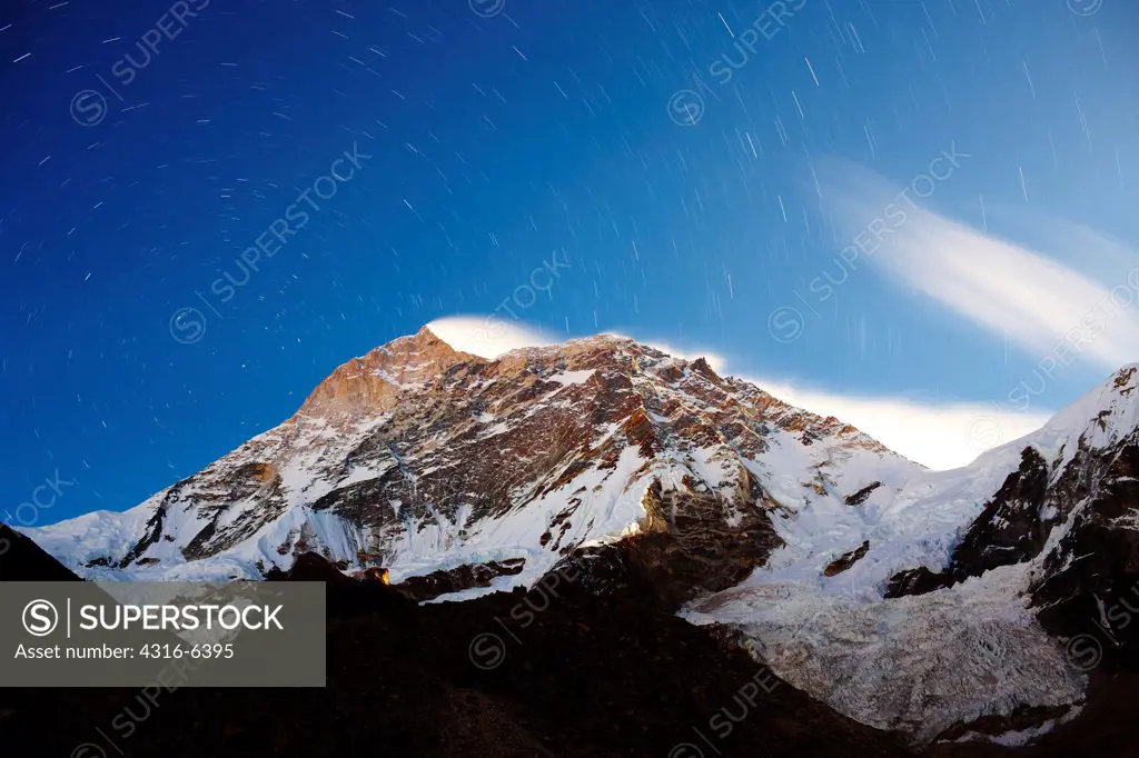 Nepal, Himalaya, Makalu-Barun National Park, snowcapped West face of Makalu with star trails, long exposure