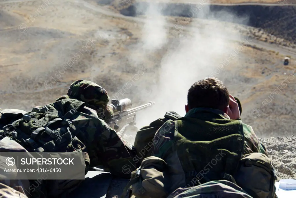 British Royal Marine firing a sniper rifle during mountain sniper training, Hawthorne, Nevada, USA