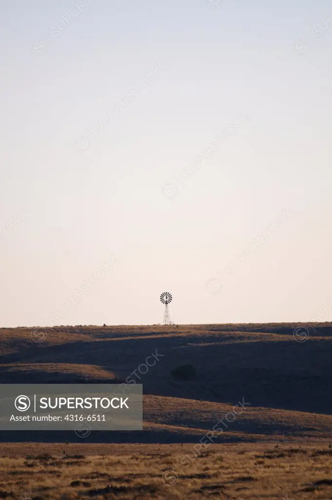 Lone windmill on open grassland, Chihuahuan Desert, Marfa, Texas, USA