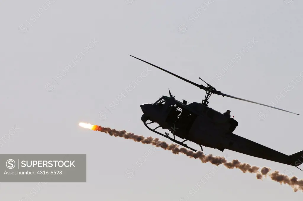US Marine Corps UH-1N Iroquois Helicopter expends a flare during a military training exercise, Chocolate Mountain Aerial Gunnery Range, California and Arizona, USA