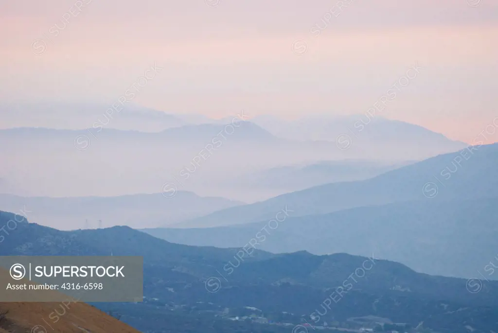 Smoke from raging wildfire obscures ridges in the San Bernardino Mountains, California, USA