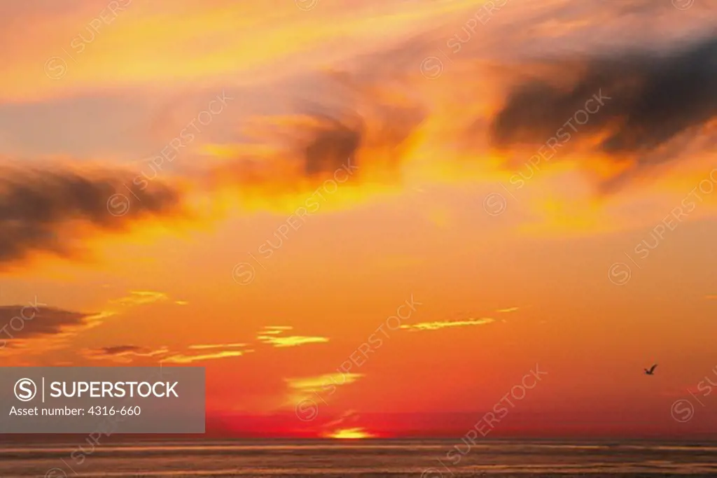 The Setting Sun Casts Light On An Arc Of Cirrus Unicus Clouds