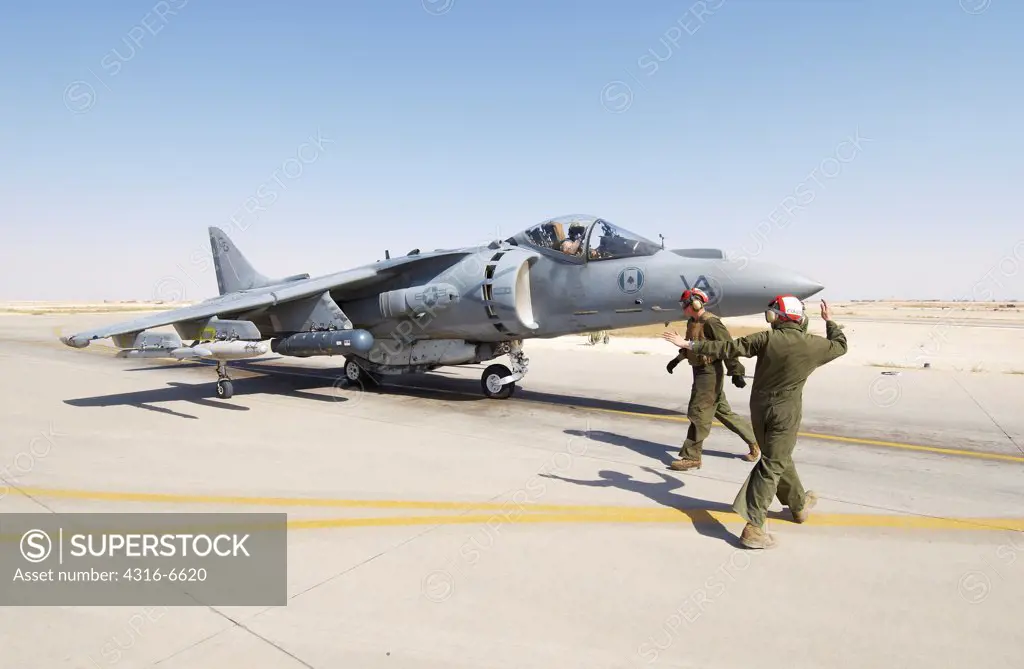 US Marine Corps aviator prepares to launch a Marine Corps AV-8B Harrier from Al Asad Air Base, Al Anbar Province, Iraq