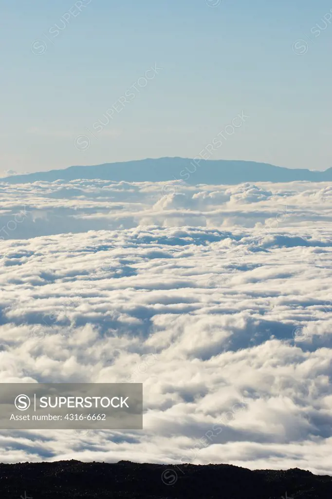 Mauna Loa above deck of clouds as seen from the summit of Mauna Kea, Hawaii County, Hawaii, USA