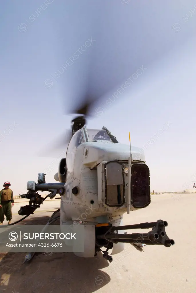 US Marine Corps AH-1W SuperCobra attack helicopter being refueled at Al Asad Air Base, Iraq