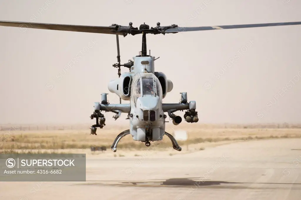 US Marine Corps AH-1W SuperCobra attack helicopter launching from Al Asad Air Base, Iraq