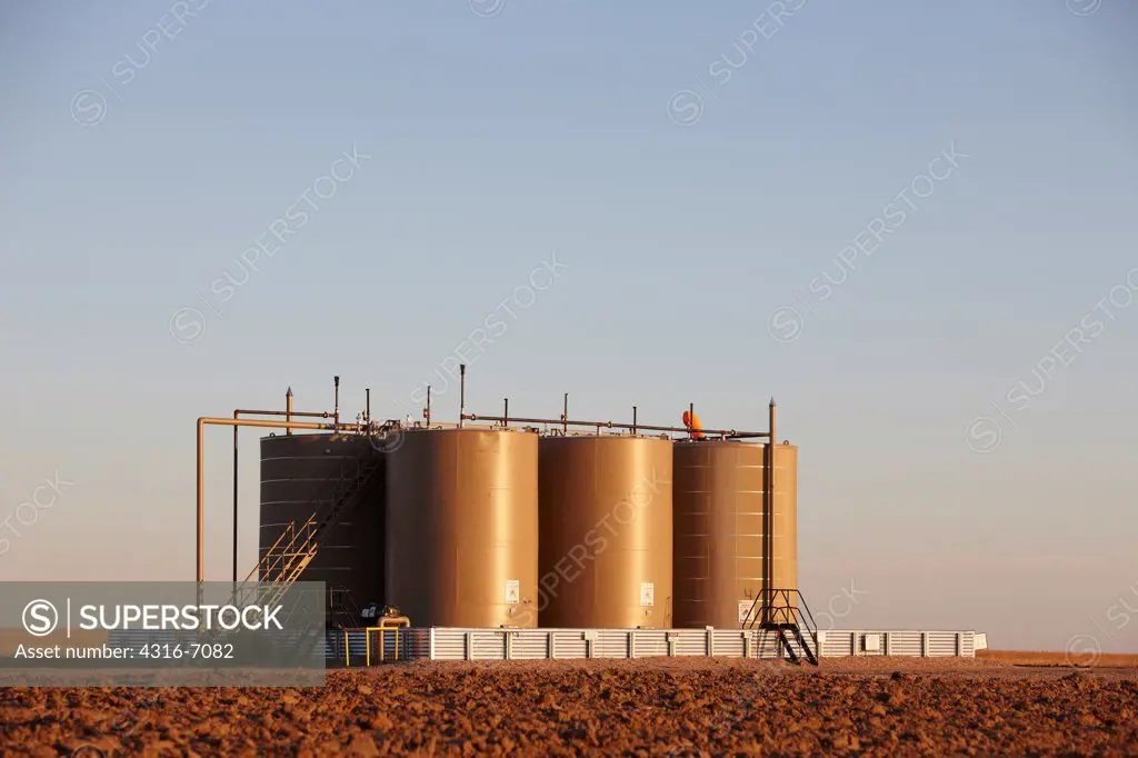Crude oil storage tanks in the eastern plains of Colorado, USA