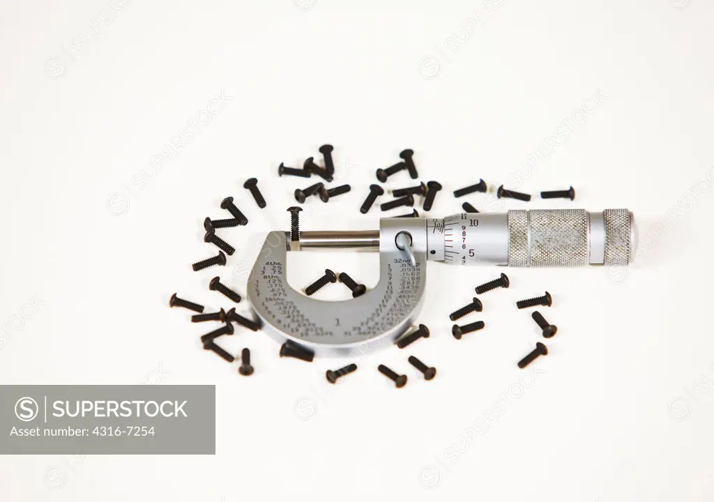 Black hex cap screws and caliper micrometer