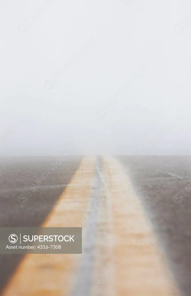 USA, Colorado, Divided road during blizzard