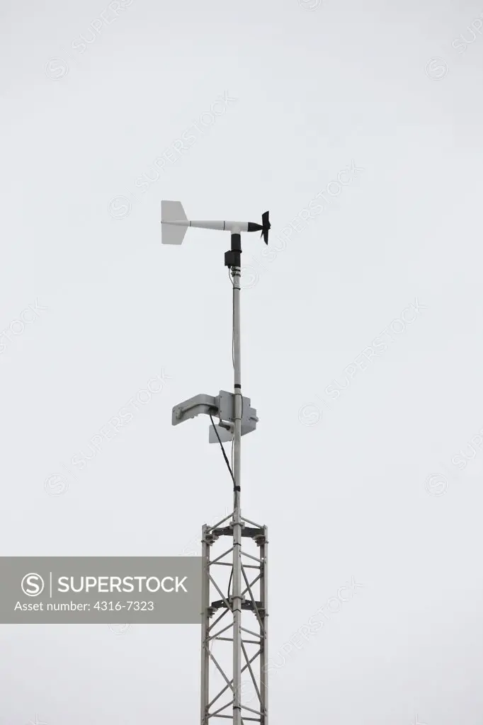 USA, Colorado, Anemometer and wind vane in wind during blizzard