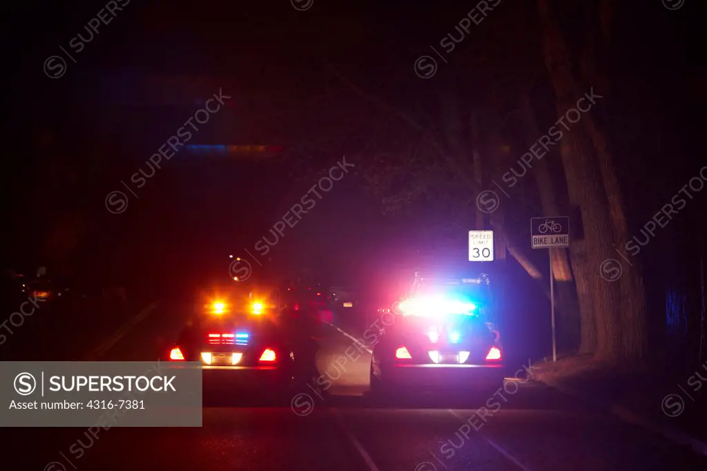 Police arresting woman at night