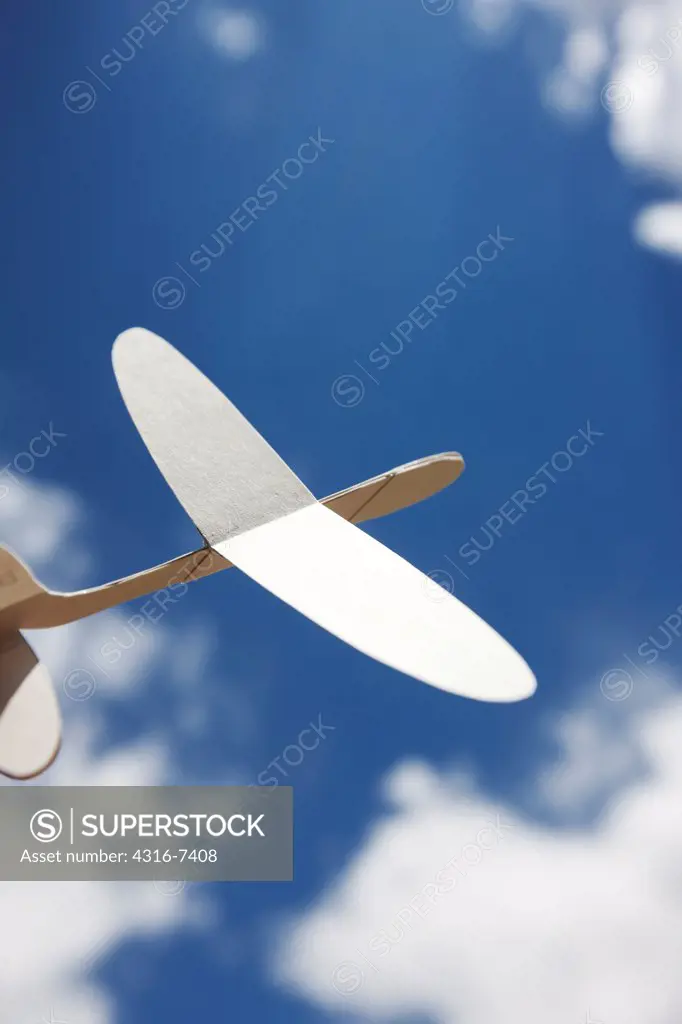 Hand launching small paperboard aircraft
