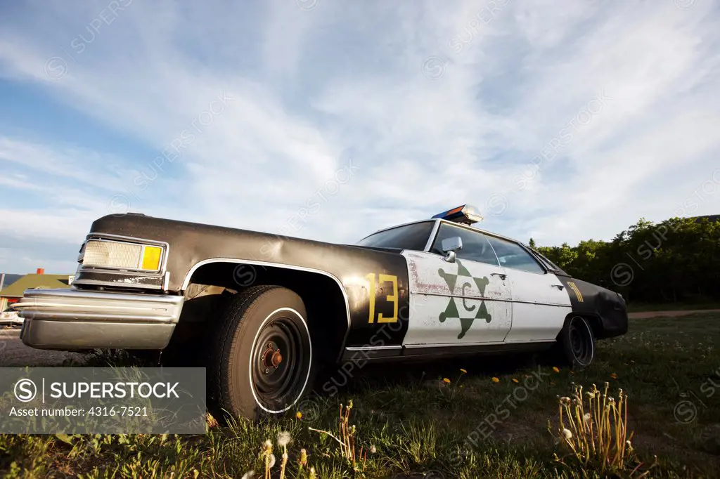 Abandoned police car at a small mountain town, Wyoming