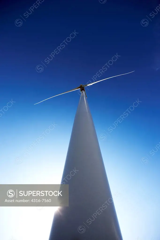 Backlit wind turbine, wide angle view, Colorado