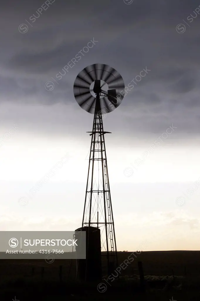 Windmill under a powerful thunderstorm with mammatus clouds, Colorado
